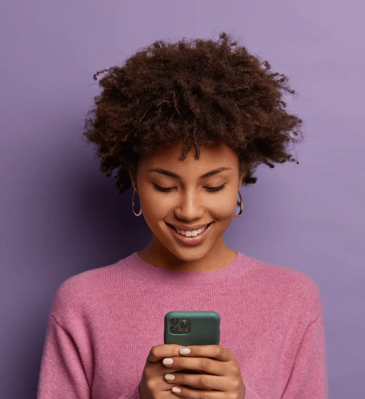 lady on her phone looking at Cheap website design package starting at R999